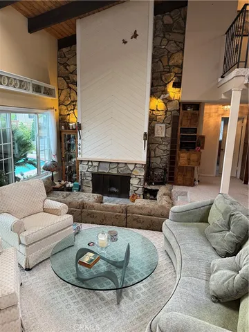 a view of a house with backyard porch and sitting area
