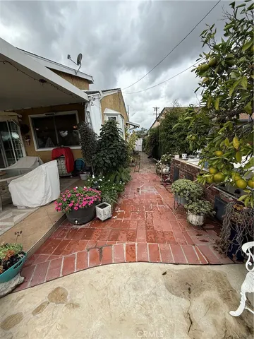 a living room with fireplace furniture and a large window