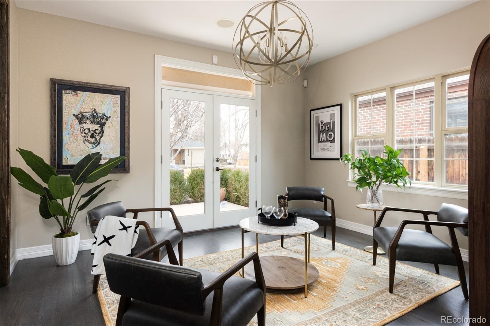 1214 South Fillmore Street Denver, CO 80210 - Photo 12 of 50 a living room with furniture a table and a potted plant