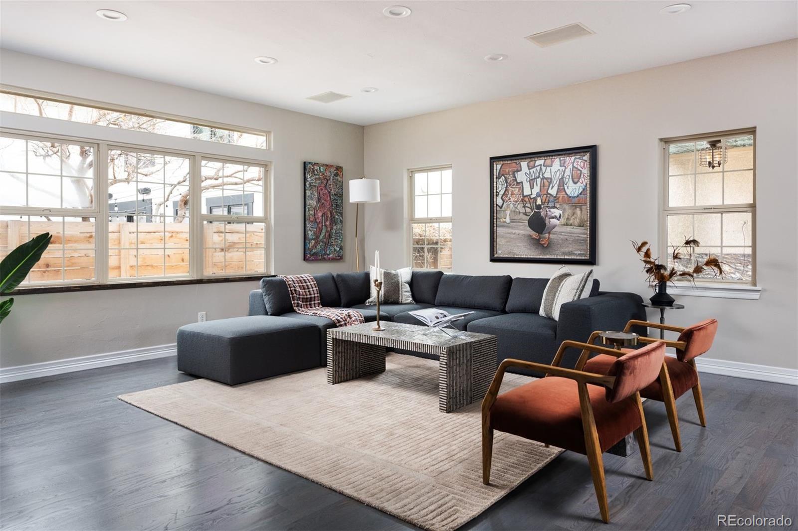 1214 South Fillmore Street Denver, CO 80210 - Photo 22 of 50 a living room with furniture a large window and a table