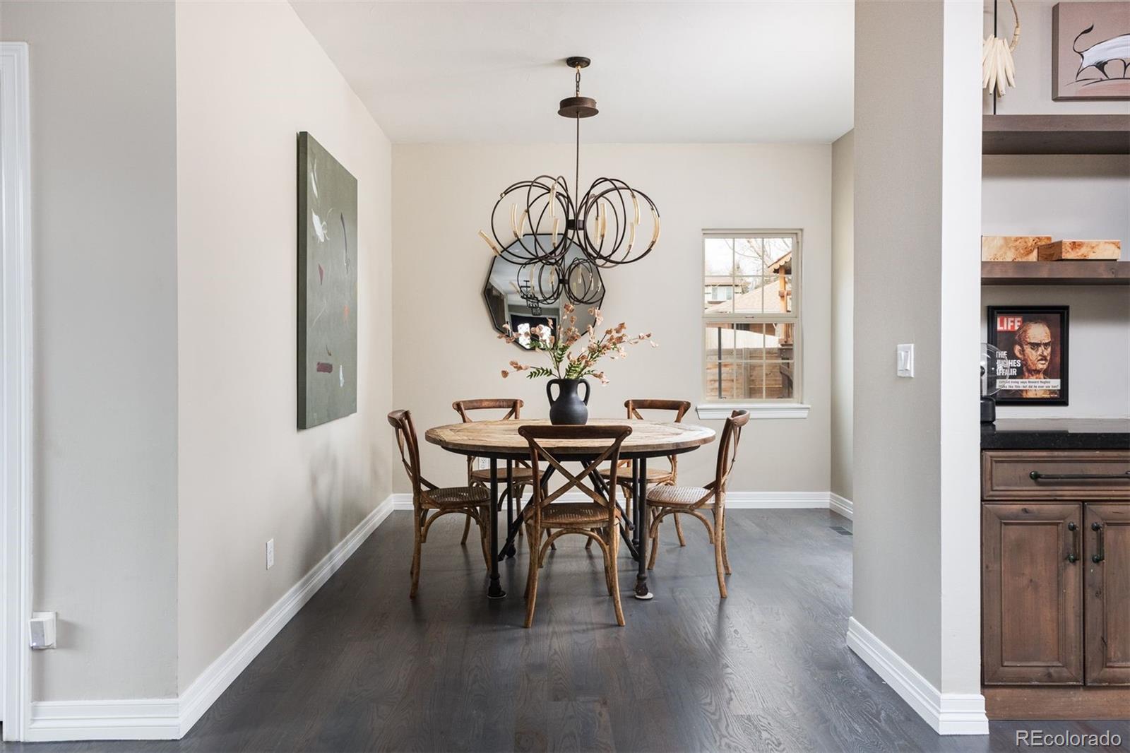 1214 South Fillmore Street Denver, CO 80210 - Photo 23 of 50 a view of a dining room with furniture window and wooden floor