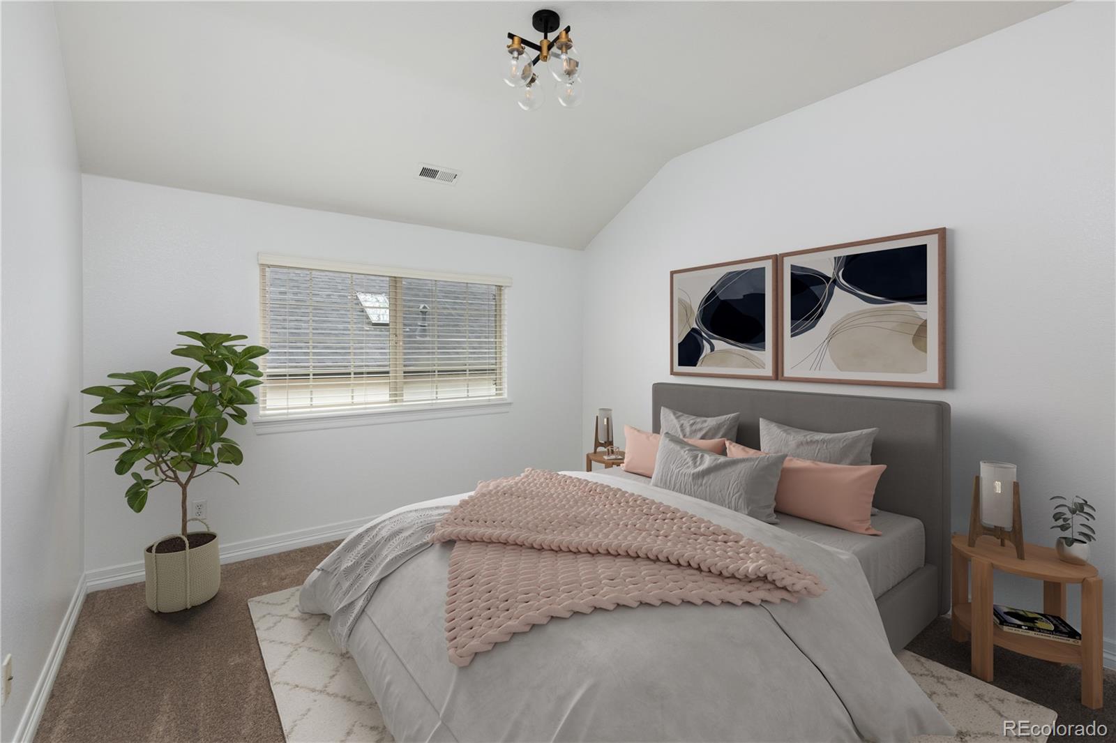 1214 South Fillmore Street Denver, CO 80210 - Photo 39 of 50 a bedroom with a bed and a potted plant