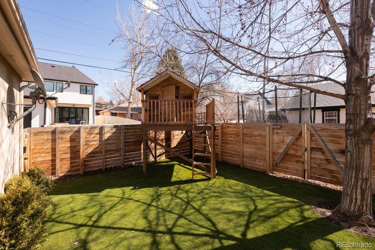 1214 South Fillmore Street Denver, CO 80210 - Photo 46 of 50 a view of a house with a backyard