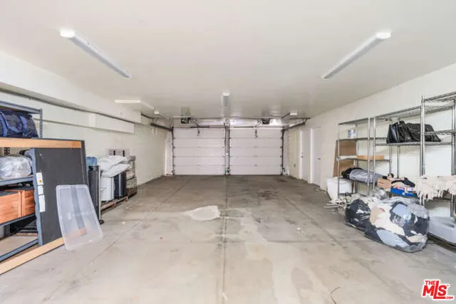 a view of storage and utility room with washer and dryer