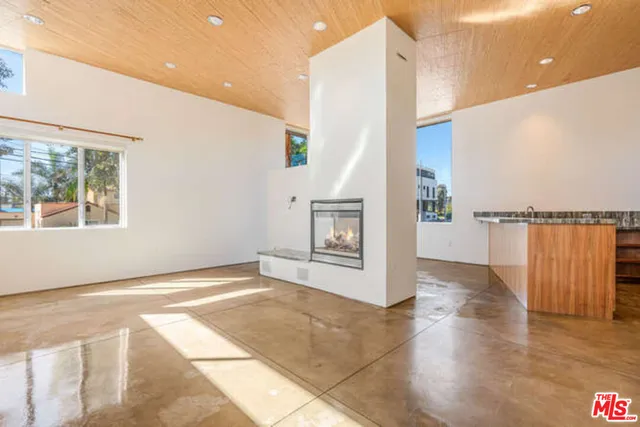 a view of a room with stairs and wooden floor