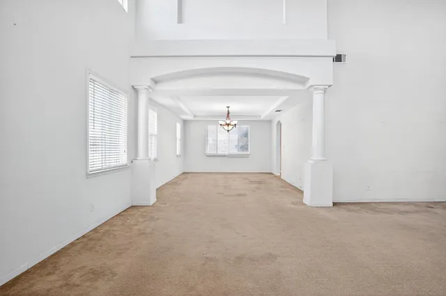 a view of an empty room and a window