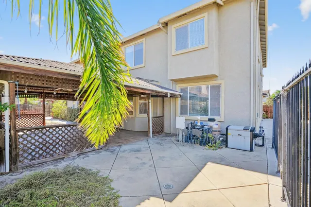 a view of a chairs and table in the patio