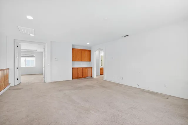 an empty room with a empty space and window