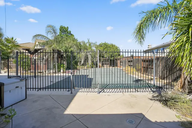 a view of a wrought iron fences in front of house
