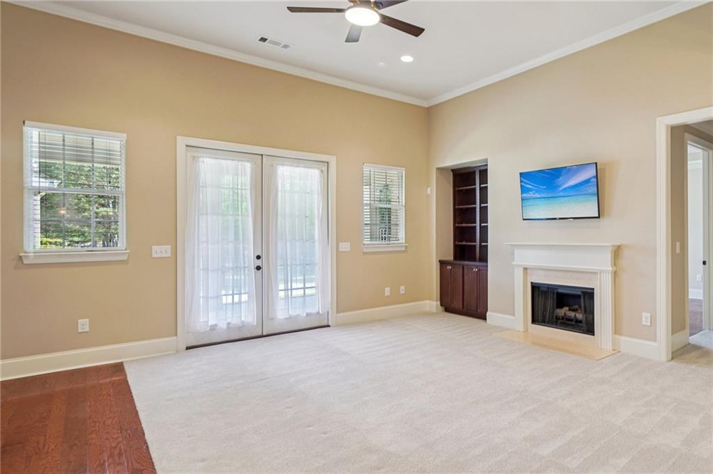 488 Townsend Street Grayson, GA 30017 - Photo 6 of 40 a view of livingroom with window fireplace and cabinet