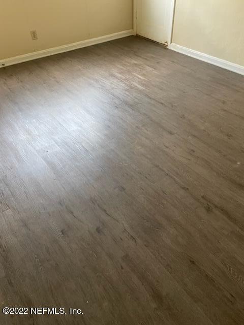 3126 Belden Circle, Unit 2 Jacksonville, FL 32207 - Photo 13 of 13 an empty room with wooden floor