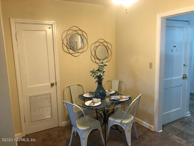 3126 Belden Circle, Unit 2 Jacksonville, FL 32207 - Photo 6 of 13 a view of a dining room with furniture and wooden floor