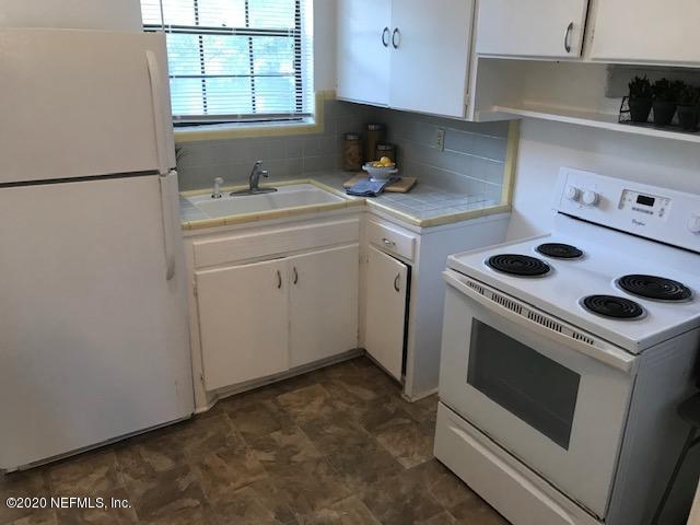 3126 Belden Circle, Unit 2 Jacksonville, FL 32207 - Photo 7 of 13 a kitchen with a stove cabinets and a sink