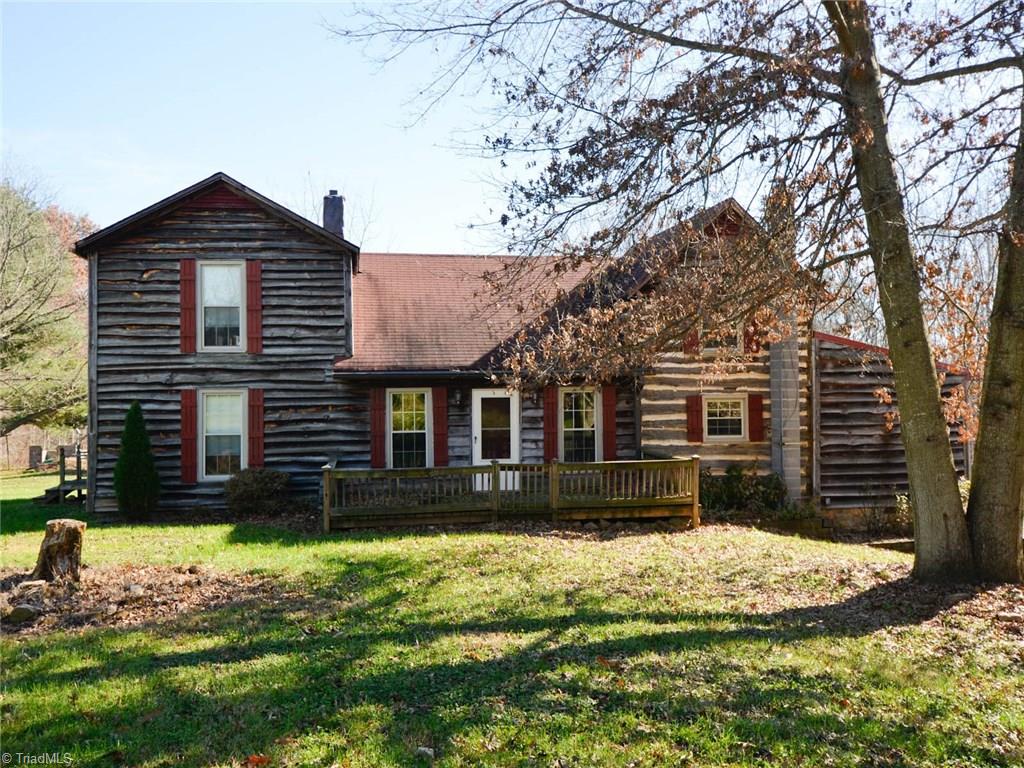 171 Guy Gaither Road Harmony, NC 28634 - Photo 2 of 21 Relax on the front porch in rocking chairs and enjoy your serene surroundings.
