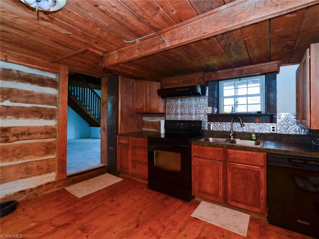 171 Guy Gaither Road Harmony, NC 28634 - Photo 11 of 21 Original plank wood floors in kitchen. Newer appliances!
