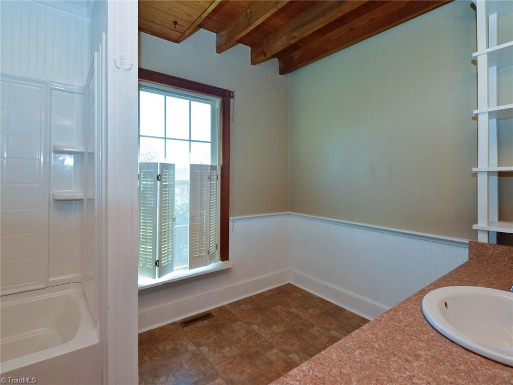 171 Guy Gaither Road Harmony, NC 28634 - Photo 14 of 21 Large downstairs full bath with built-in storage space.