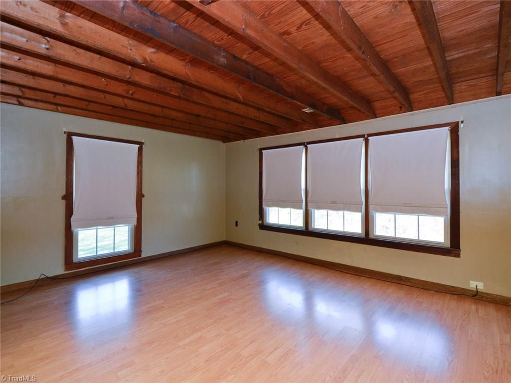171 Guy Gaither Road Harmony, NC 28634 - Photo 15 of 21 Master bedroom has views all around the home.