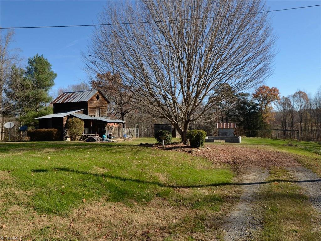 171 Guy Gaither Road Harmony, NC 28634 - Photo 3 of 21 Storage buildings on property give you plenty of storage room.