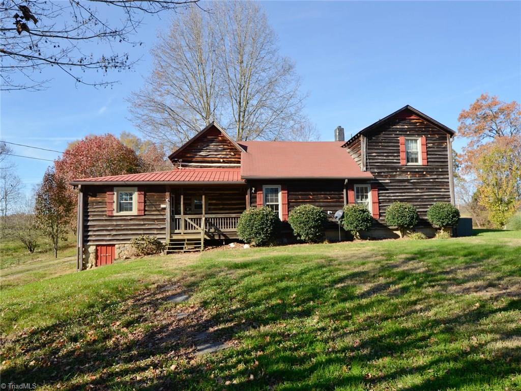 171 Guy Gaither Road Harmony, NC 28634 - Photo 4 of 21 Relax on the back porch and watch the dogs play or kids run free.