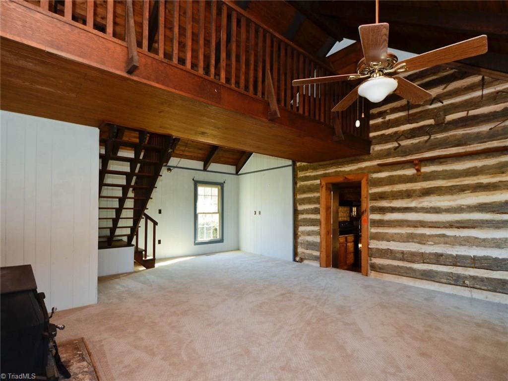 171 Guy Gaither Road Harmony, NC 28634 - Photo 7 of 21 Beautiful exposed log in the home adds so much character!