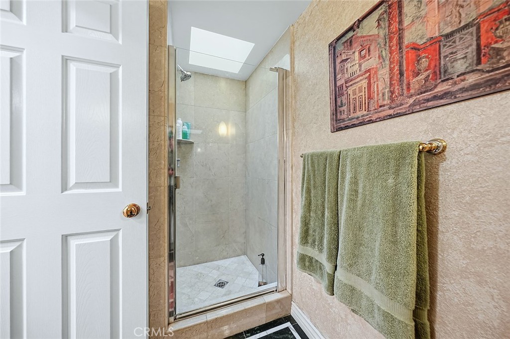 80 North Raymond Avenue, Unit 212 Pasadena, CA 91103 - Photo 17 of 24 a bathroom with a shower