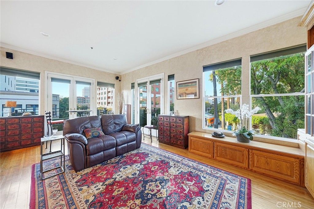 80 North Raymond Avenue, Unit 212 Pasadena, CA 91103 - Photo 5 of 24 a living room with furniture and a rug