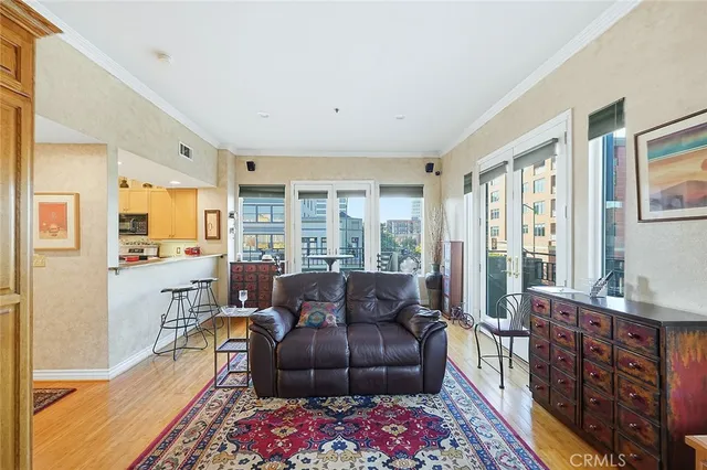 a living room with furniture and a floor to ceiling window