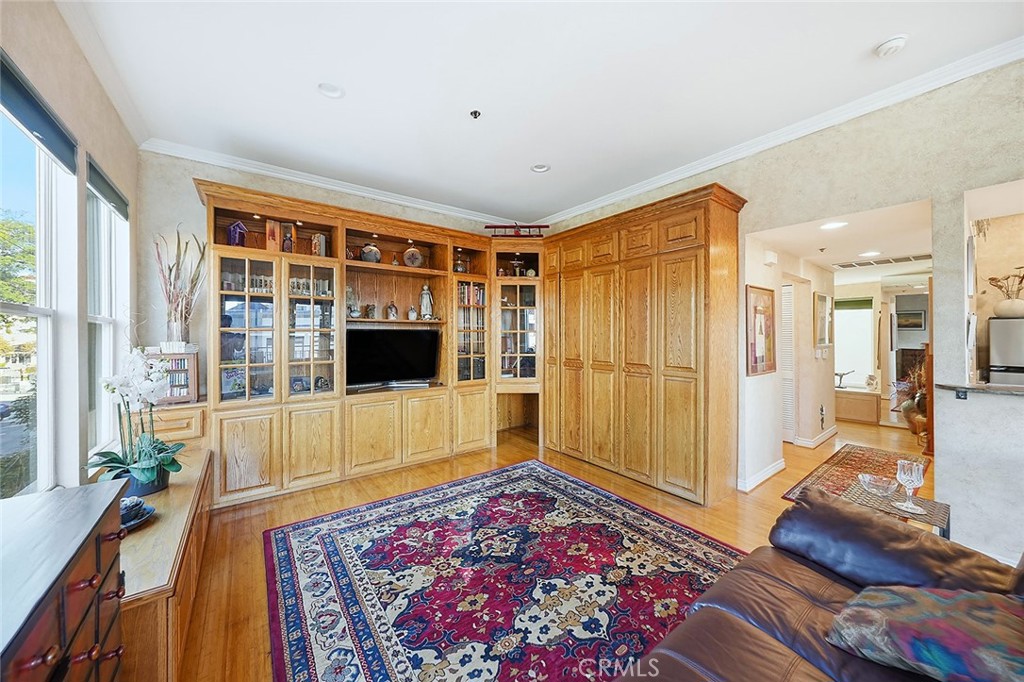 80 North Raymond Avenue, Unit 212 Pasadena, CA 91103 - Photo 7 of 24 a living room with a couch and a table
