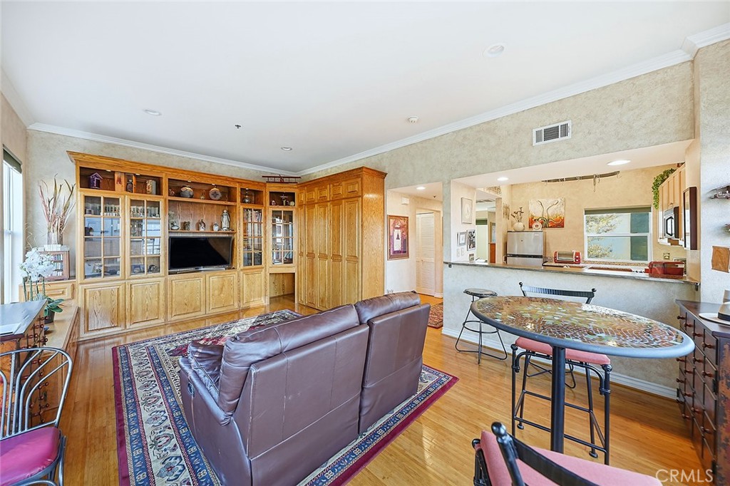 80 North Raymond Avenue, Unit 212 Pasadena, CA 91103 - Photo 8 of 24 a living room with furniture and a flat screen tv