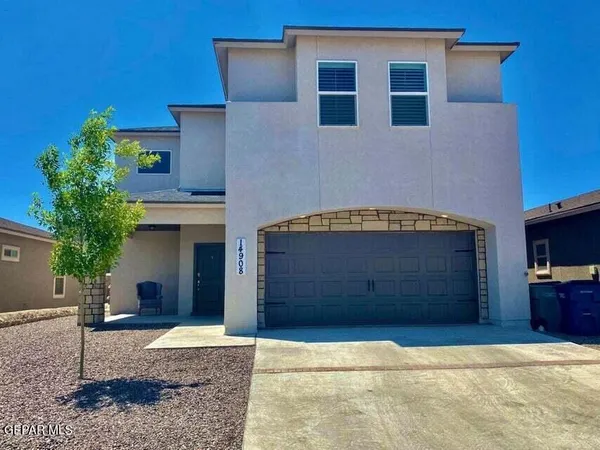 a front view of a house with garage