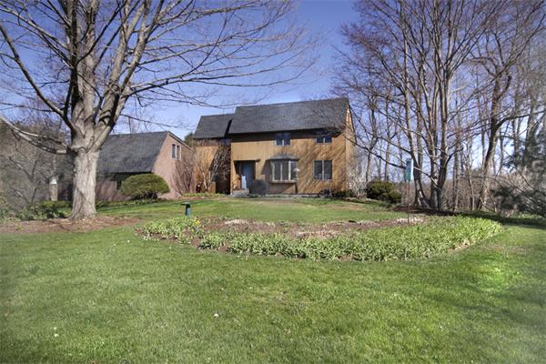 676 Lowell Road Concord, MA 01742 - Photo 1 of 18 a view of a house with a back yard