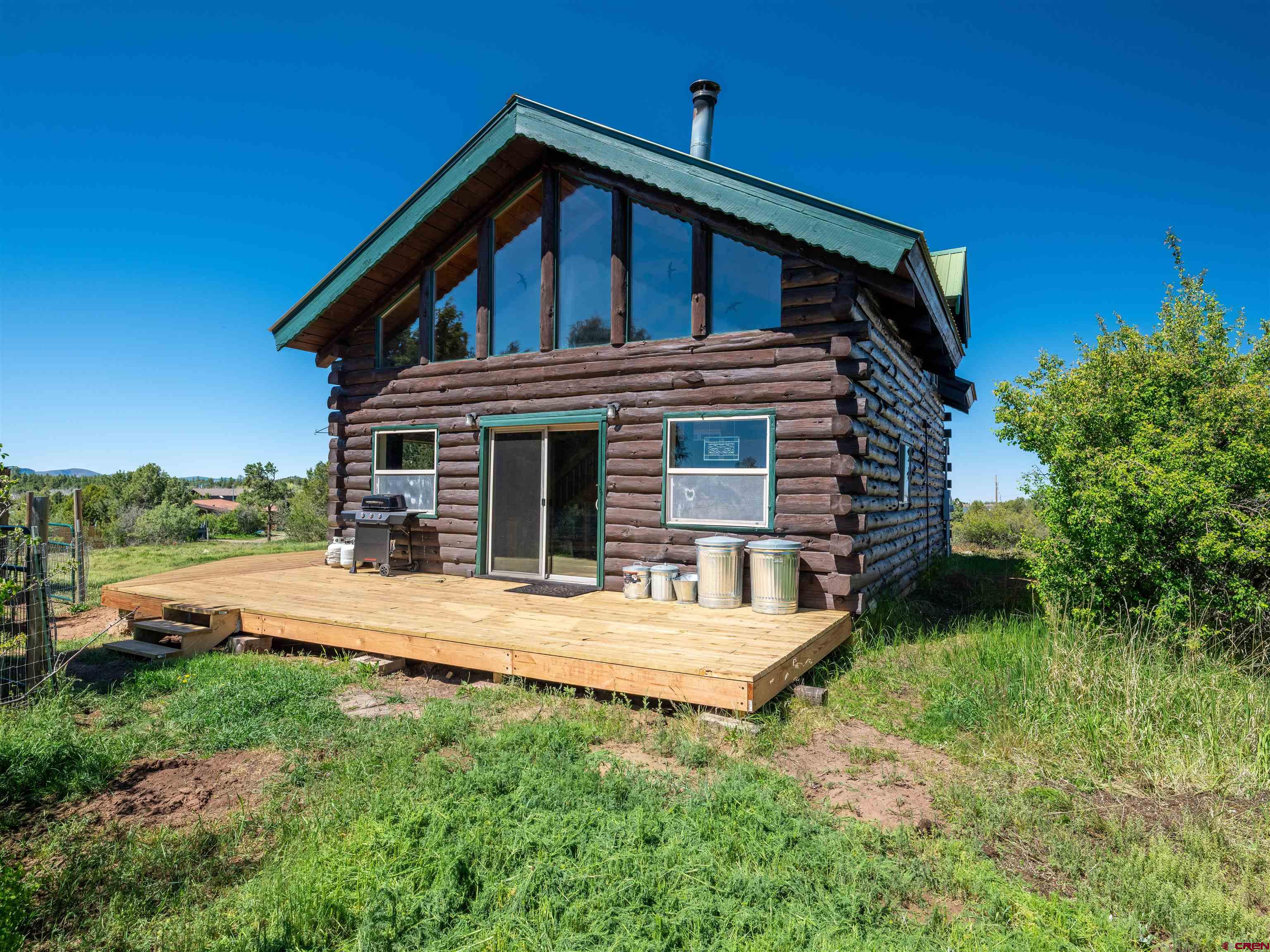 36859 Rd P.2 Mancos, CO 81328 - Photo 4 of 28 a front view of a house with garden