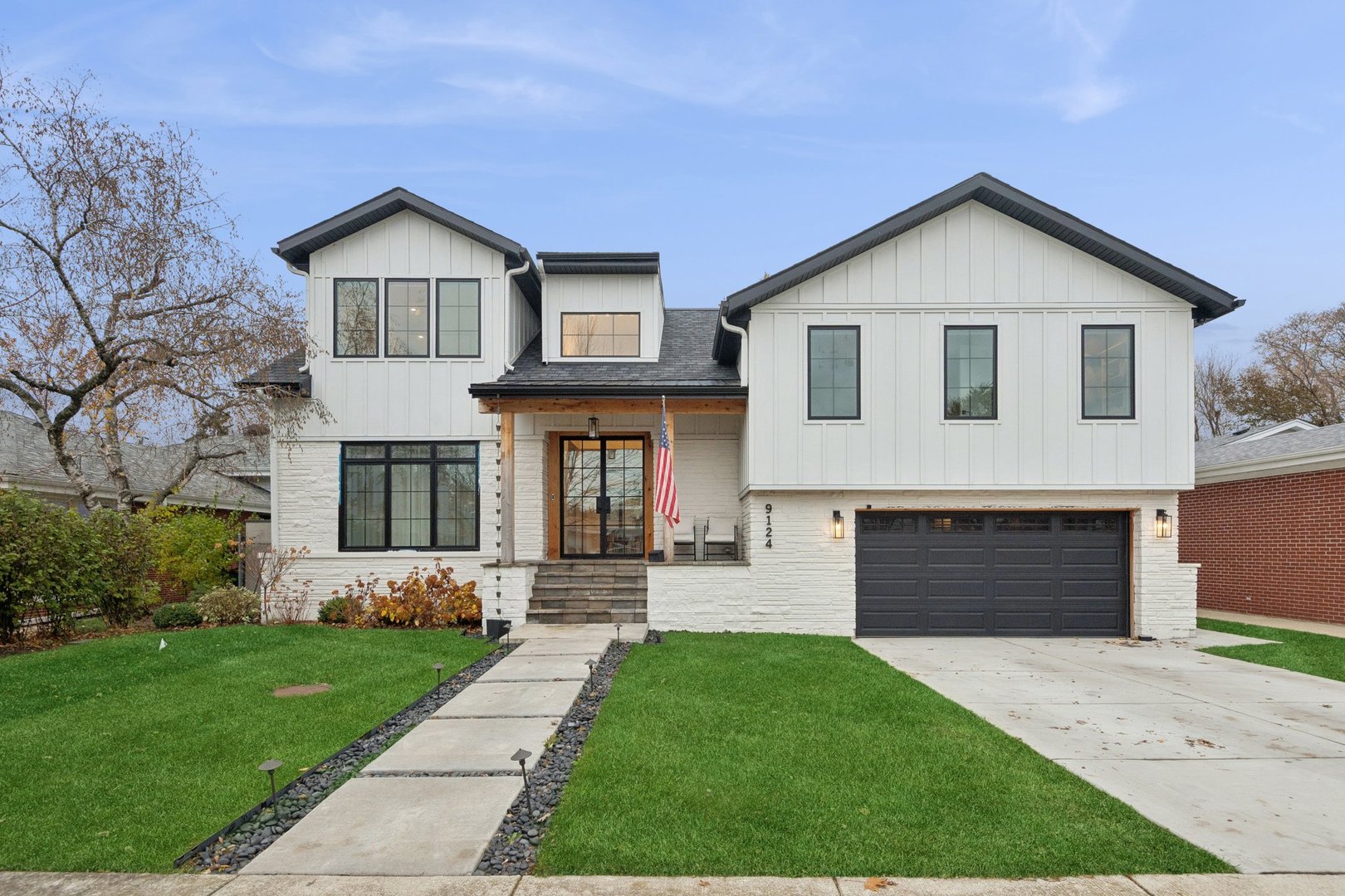 9124 Kilbourn Avenue Skokie, IL 60076 - Photo 1 of 1 a front view of a house with a yard and garage