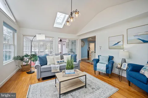 a living room with furniture and a rug