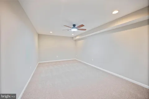 a view of an empty room with a cabinet