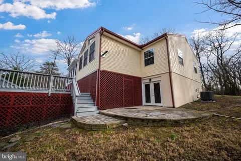 a view of a house with a yard covered with snow in the background