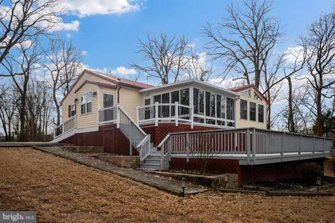 a lake view with boat and palm trees