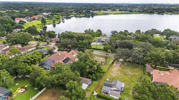 an aerial view of lake residential houses with outdoor space and lake view