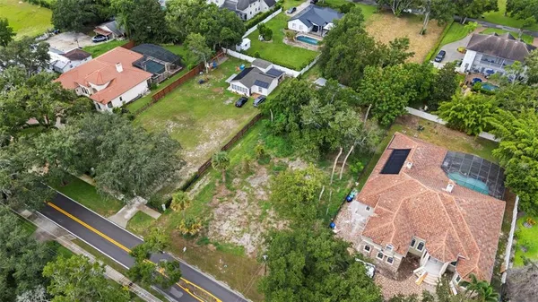 an aerial view of house with yard