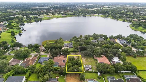 an aerial view of a city with lake view