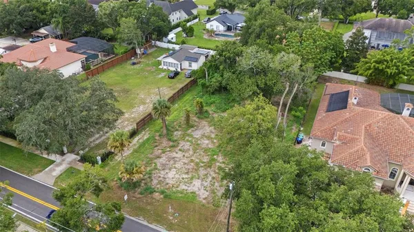 an aerial view of house with yard