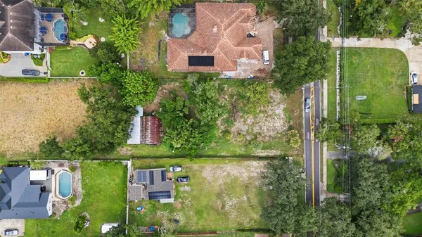 an aerial view of residential house with outdoor space and lake view