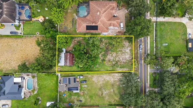 an aerial view of residential house with outdoor space and swimming pool