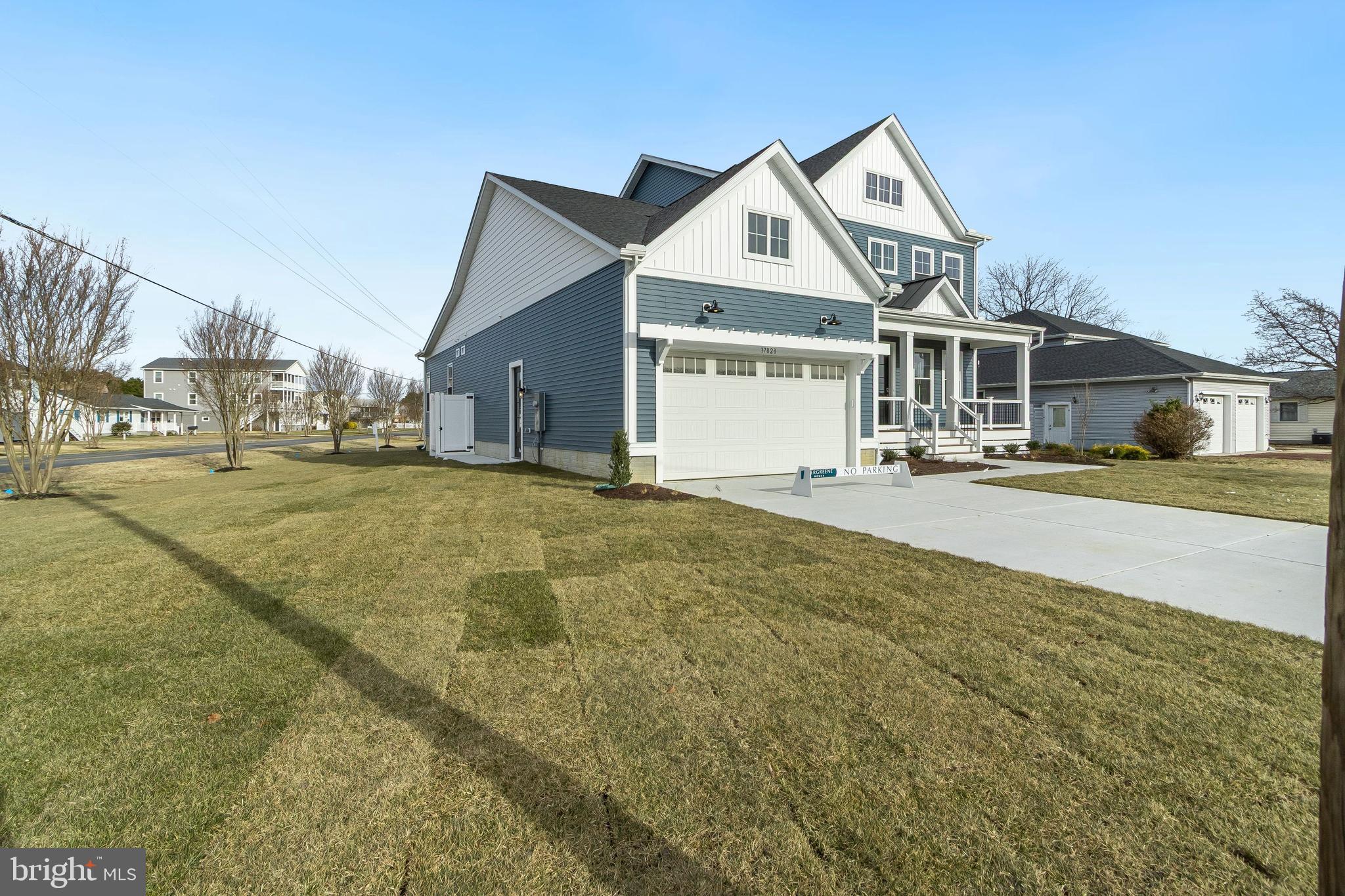 37828 Cedar Road Selbyville, DE 19975 - Photo 3 of 109 a front view of a house with a yard