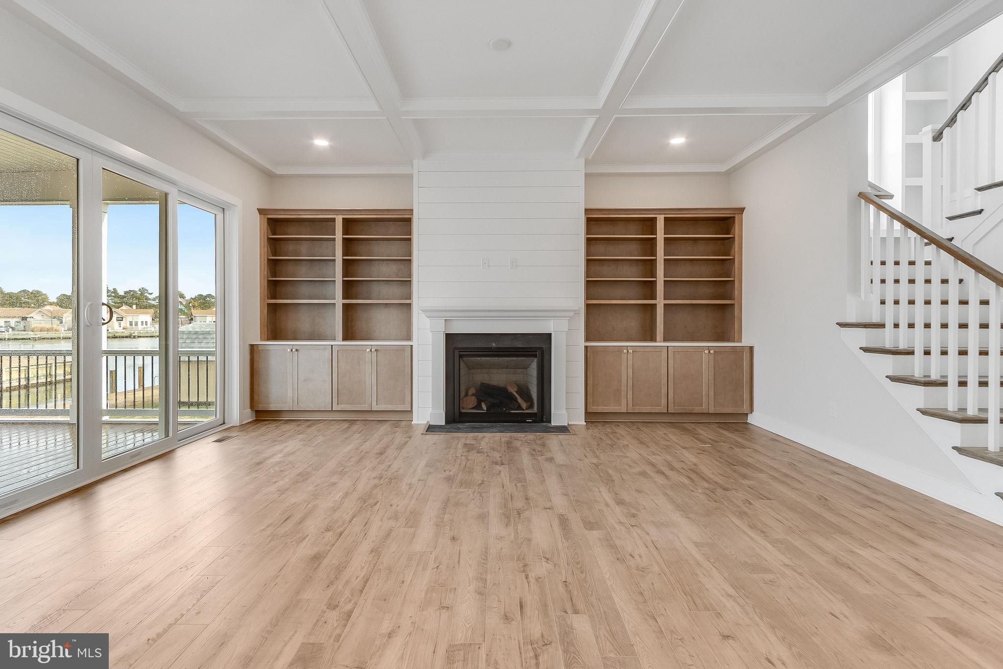 37828 Cedar Road Selbyville, DE 19975 - Photo 34 of 109 Living Area with gas fireplace and built-ins