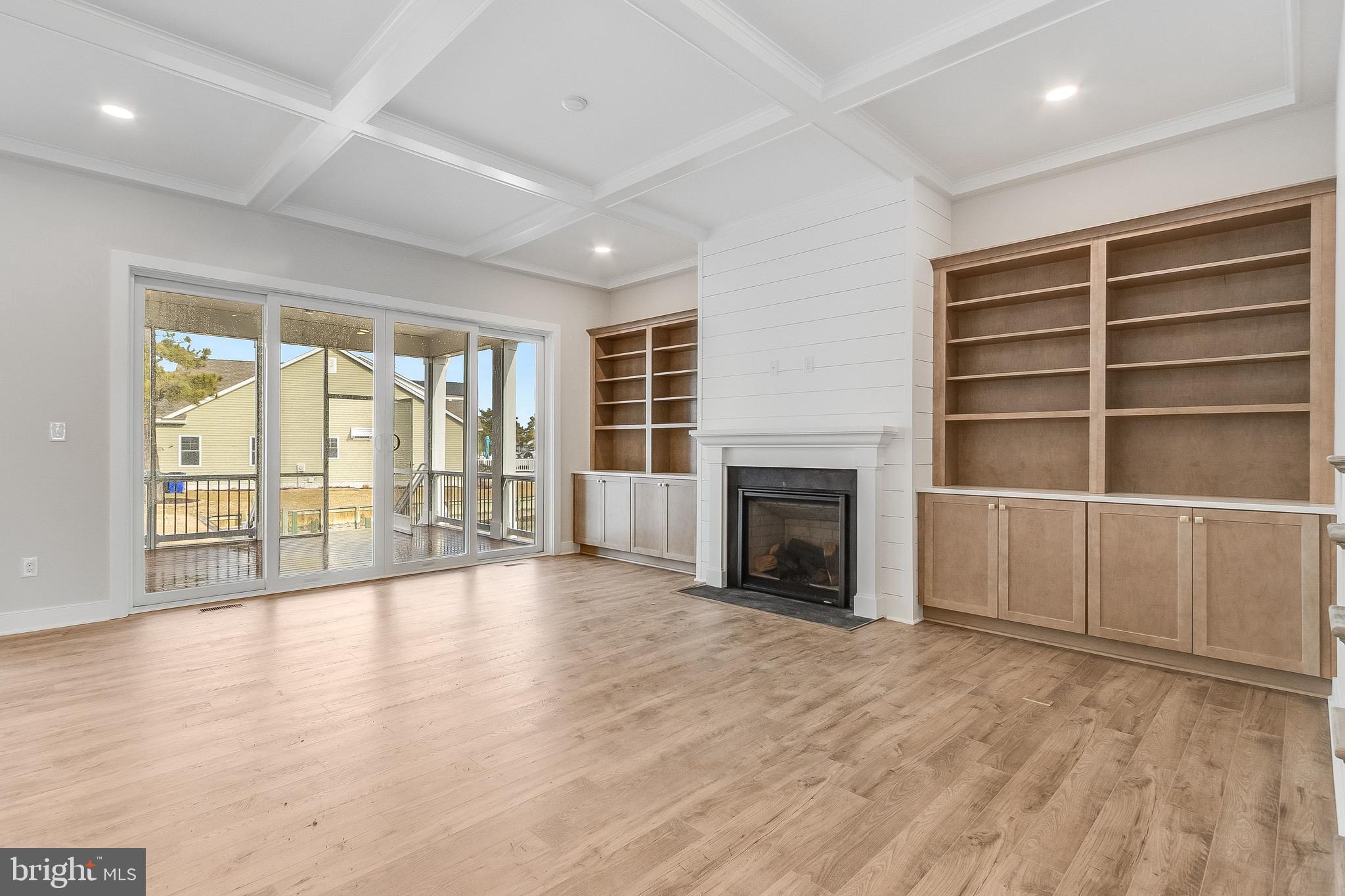 37828 Cedar Road Selbyville, DE 19975 - Photo 35 of 109 Living Area with gas fireplace and built-ins