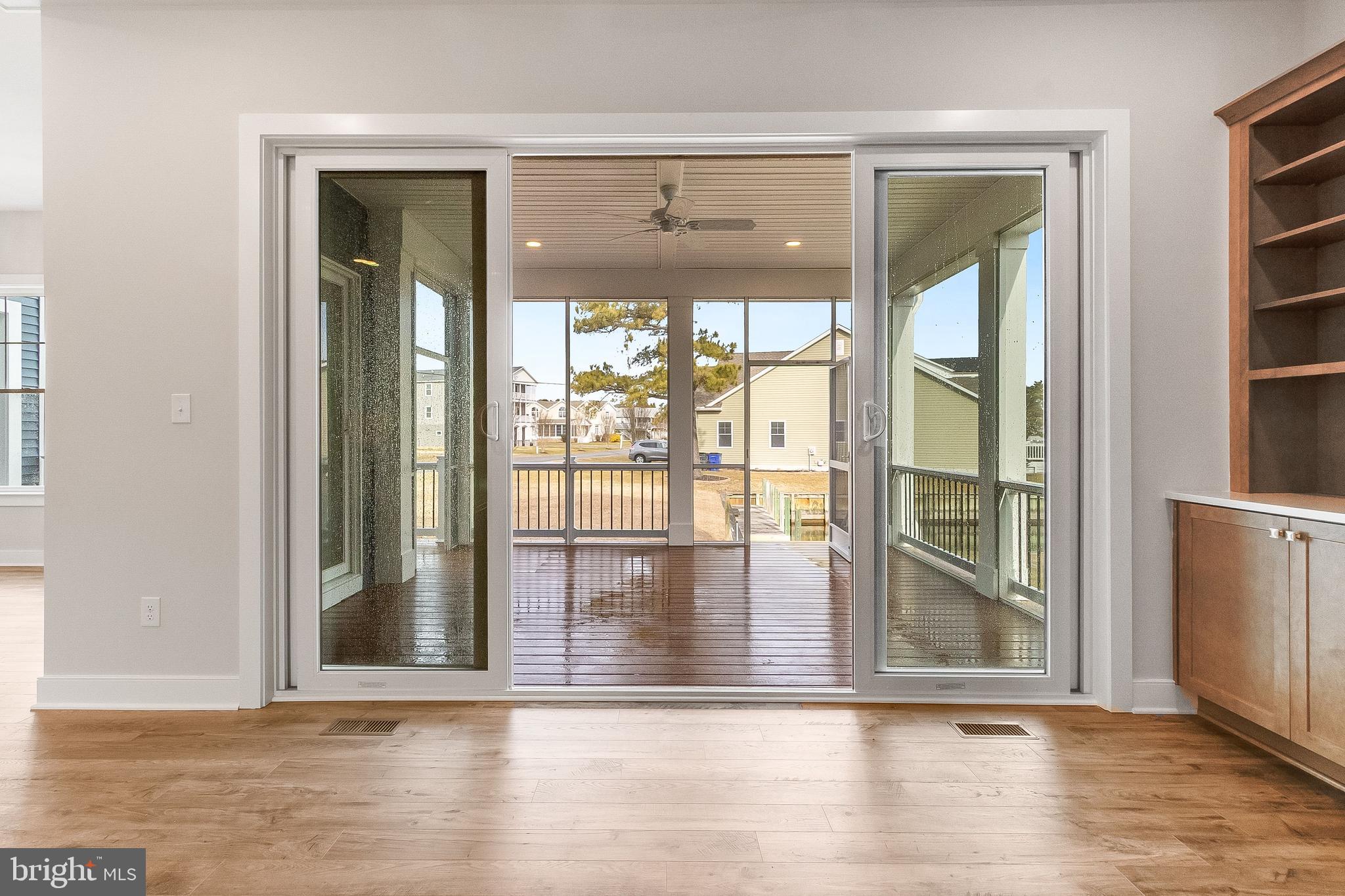 37828 Cedar Road Selbyville, DE 19975 - Photo 43 of 109 covered screened porch off main living.