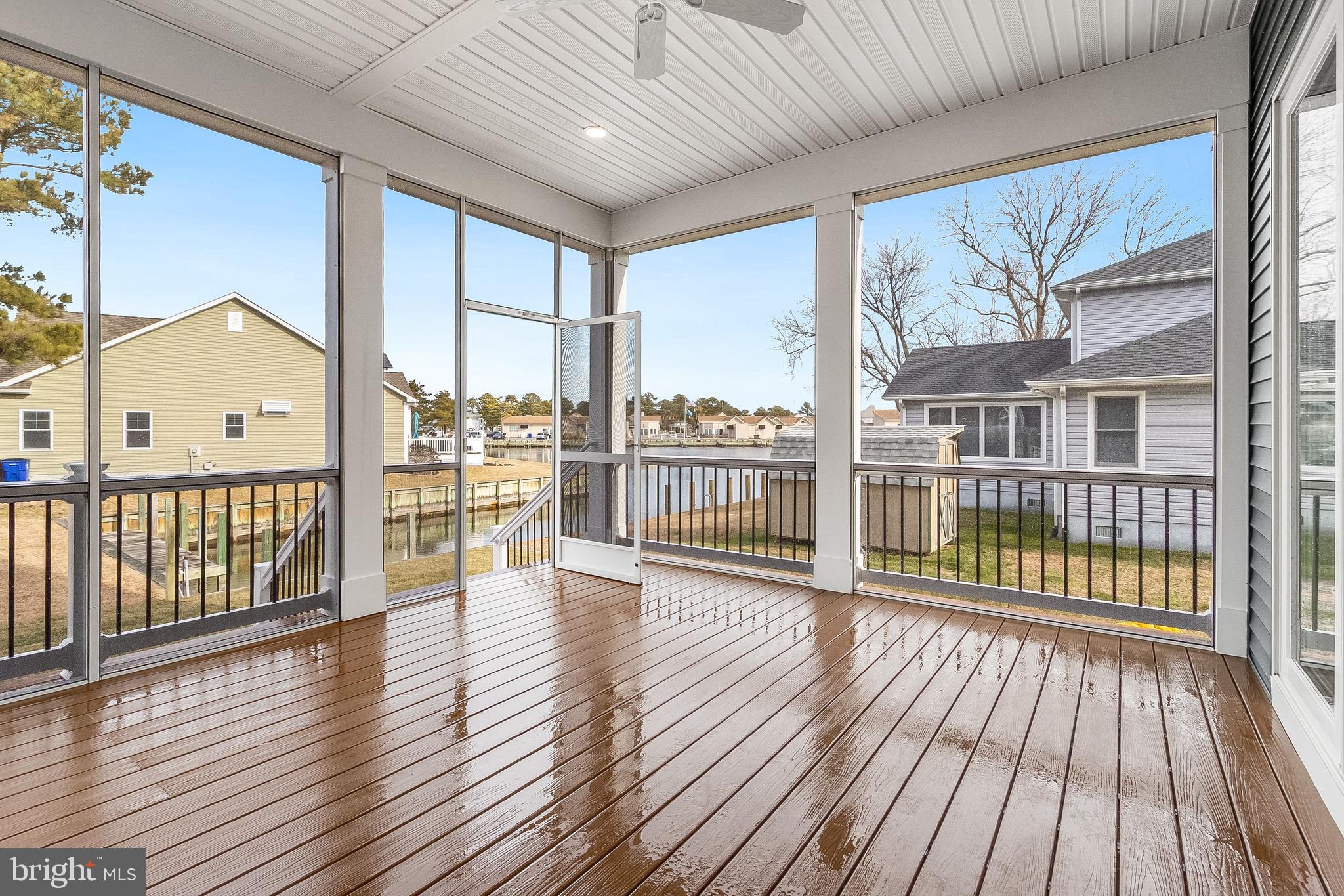 37828 Cedar Road Selbyville, DE 19975 - Photo 48 of 109 covered screened porch off main living.