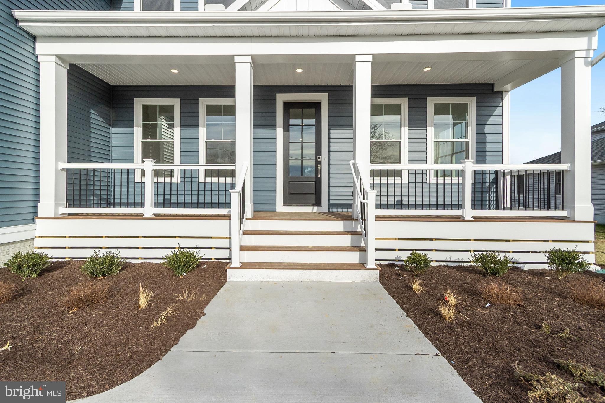 37828 Cedar Road Selbyville, DE 19975 - Photo 5 of 109 a view of a house with a large window