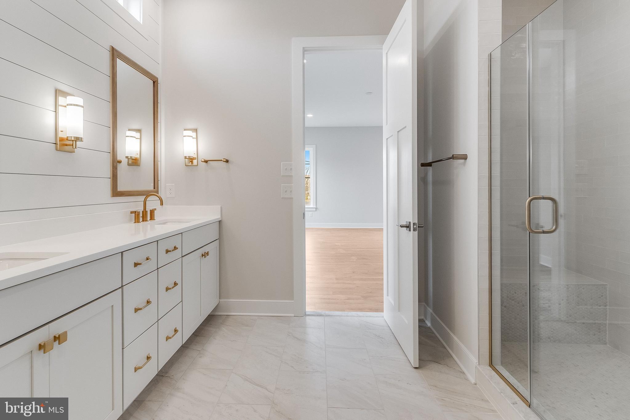 37828 Cedar Road Selbyville, DE 19975 - Photo 54 of 109 a spacious bathroom with a double vanity sink a shower and a mirror